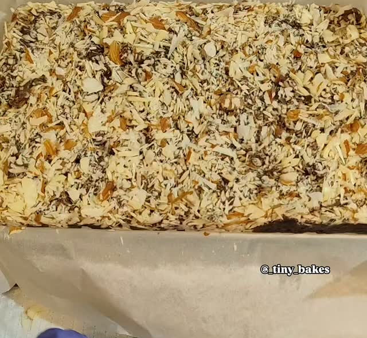 Tray bake covered in toasted almond flakes