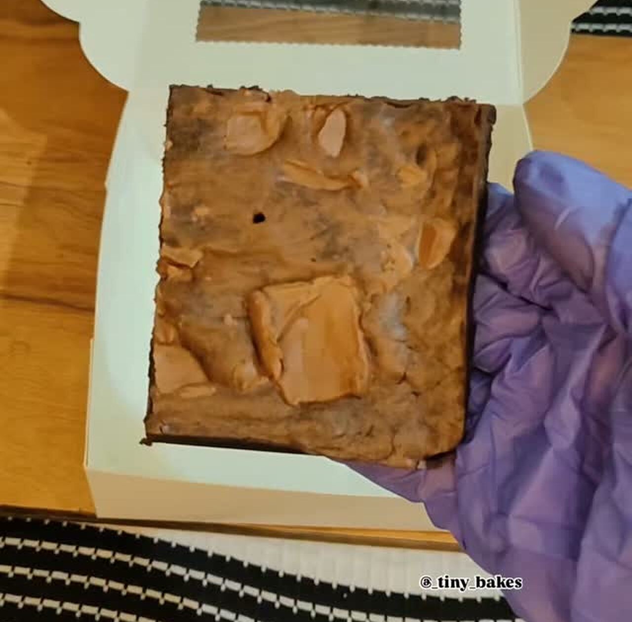 Golden blondie square topped with biscuit chunks